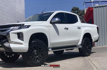 MITSUBISHI TRITON VAPOR BLACK MACHINED WITH DARK TINT
